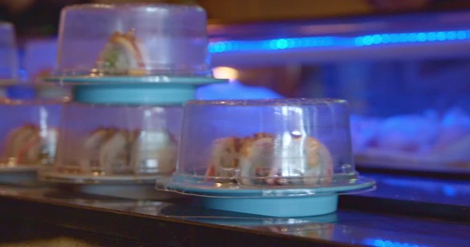Sushi Containers on Conveyor Belt