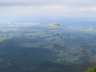 paraglider flight in cloudy day