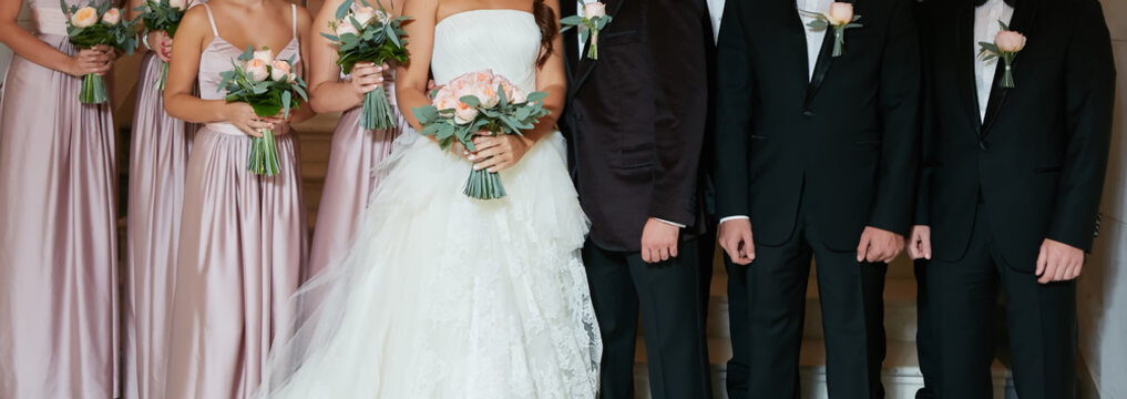 Row Of Bridesmaids And Groomsmen At Big Wedding Ceremony