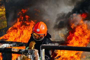 Brave Firefighter fighting a fire, firefighter training