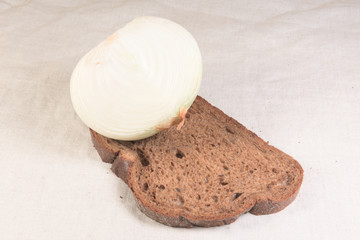 half onions and bread on the table