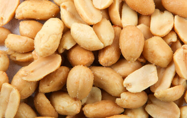 Fototapeta na wymiar Close-Up Of Peeled Peanuts Background
