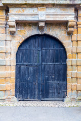 Grunge wooden door, ancient european tourist city