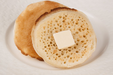 Delicious fresh British crumpets with butter