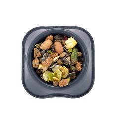 a variety of nutritious, balanced granulated food for rodents in bowl isolated on white background