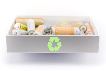 box alkaline with carbon zinc batteries and rechargeable with a sign of recycling, loop, concept of battery recycling, environmental protection