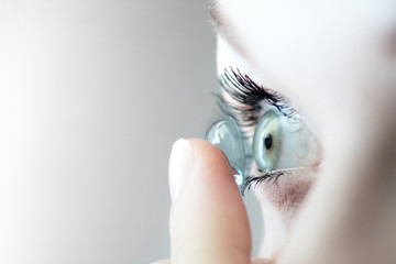 girl wearing soft contact lenses close-up macro