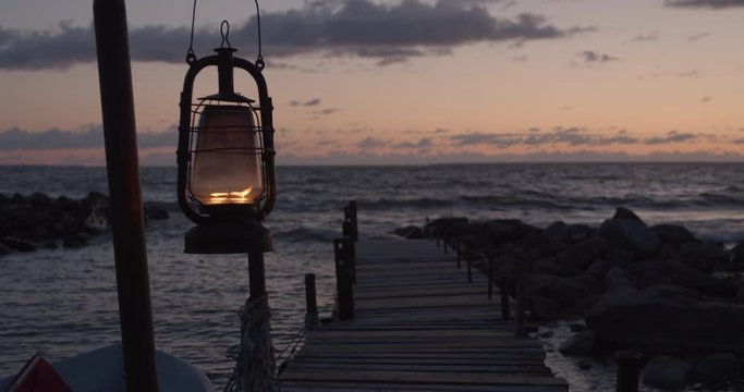 Oil lantern burning on fishing boat dock