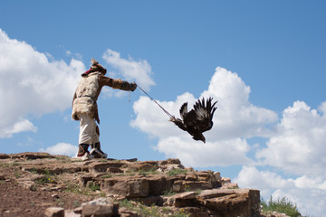 Kazakh eagle hunter in altai mountains, mongolia