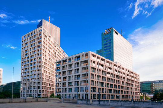 Fototapeta Modern apartment residential and flat building exterior at Vienna in Austria. New luxury house and home complex. City Real estate property and condo architecture. Facade of condominium block.
