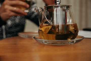 Process brewing tea,tea ceremony,Cup of freshly brewed black tea,warm soft light