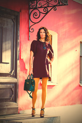 fashion. beautiful woman in a stylish burgundy dres