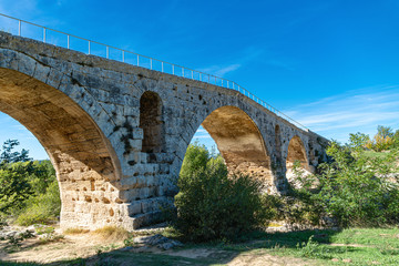 Fototapeta na wymiar Antique roman bridge made with stones, France