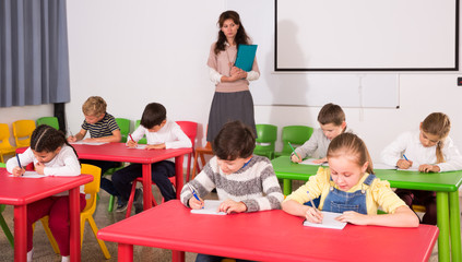 School kids studying in classroom