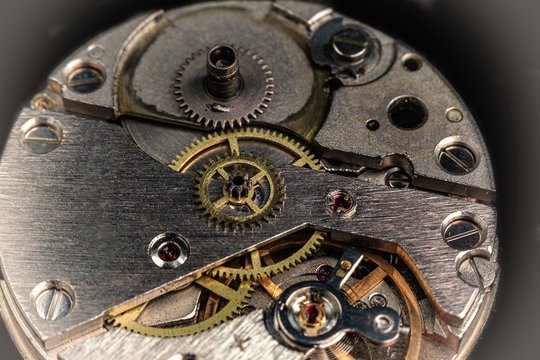 vintage old mechanism with gears and springs, clock mechanism close-up macro
