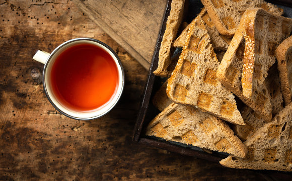 warm tea and toasted bread on a table