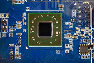 a chip in a computer with many electrical elements, a CPU, a GPU, a microchip in an electronic...