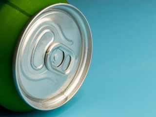 aluminum soda and beer beverage can with water droplets isolated on blue background, metal can, recyclable product