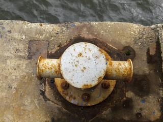 mooring at the berth by the river in the port, fixing ropes for parking ships