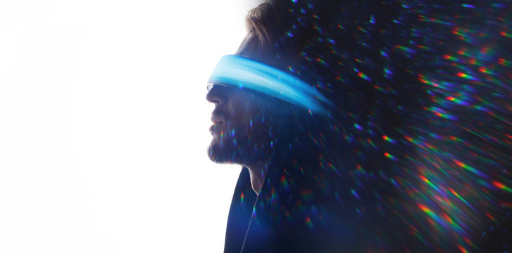 Double exposure of male face. Abstract man portrait. Digital art. Guy in glasses of virtual reality. Augmented reality, dream, future technology, game concept. VR. Blue neon light, rainbow flares.
