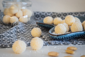 Fototapeta na wymiar Fresh baked homemade coconut balls, traditional Czech Christmas sweets