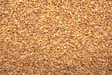 Buckwheat background. Top view. Food background. Buckwheat grains texture