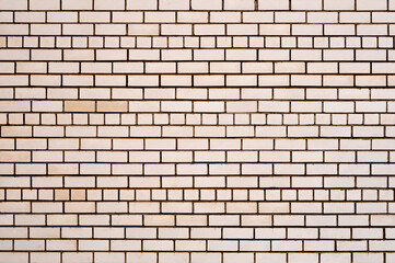 Clean smooth brick wall close-up. Texture of a brick wall