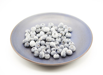 food style white Tasty frozen blueberries organic plate