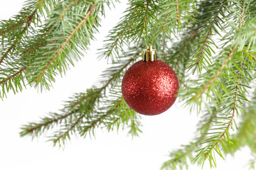 Obraz na płótnie Canvas Red Christmas shiny ball isolated on white background. Large glitter Christmas ornament. 
