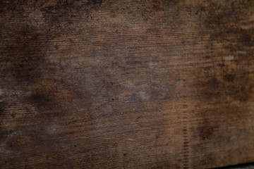 Image of a wooden table in front of an abstract background.