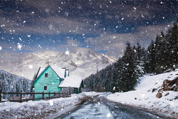 Fototapeta na wymiar Wooden cottage in a fairy-tale winter landscape.