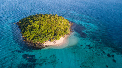Aerial view on the small green isolated island 