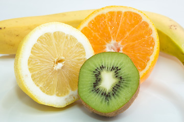 Still life of fruit close up of kiwi, orange, lemon