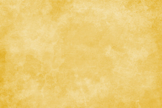 Faded gold or yellow vintage background texture with old beige paper or parchment grunge in elegant antique design