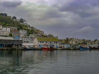 Fototapeta na wymiar Boats on the river in the small coastal town of Looe in Cornwall, UK