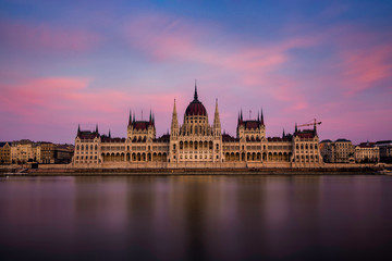 Fototapeta premium The Hungarian Parliament in symmetry after sunset in blue hour.