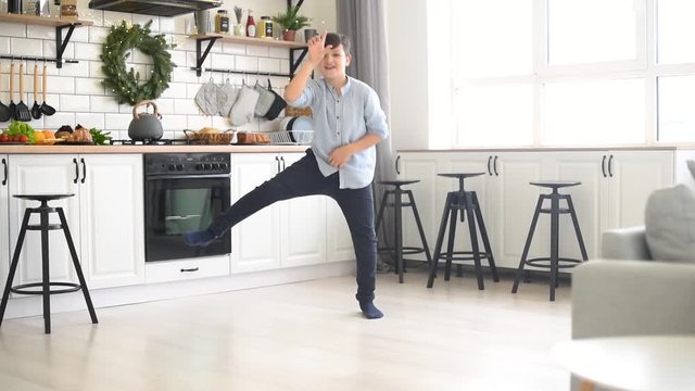 Handsome boy dancing take the l