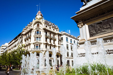 Granada, Spain. Early XX century building in the intersection of Gran Via and Reyes Católicos streets 