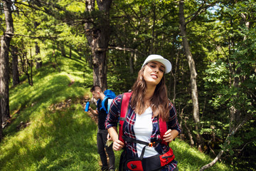 Fototapeta na wymiar Hiking couple with backpack in nature