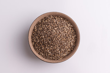 Chia seeds  isolated on white background, angle view, copy space, studio shot, soft light. Latin name (Salvia hispanica).
