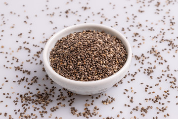 Chia seeds  isolated on white background, angle view, copy space, studio shot, soft light. Latin name (Salvia hispanica).