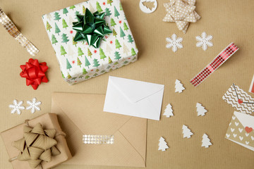 Fototapeta na wymiar Wpapped gift box on the table, winter holidays seasonal gifting concept