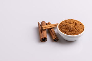 Cinnamon sticks isolated on white background, copy space, studio shot, soft light, top view.  Latin name  Cinnamomum cassia