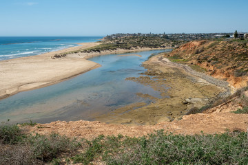 Onkaparinga River on a bright sunny day at low tide in Port Noarlunga South Australia on 19th November 2019
