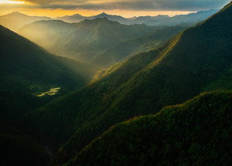 Mountain Hills with Sunrise / Sunset Rays in mountain Province - obrazy, fototapety, plakaty