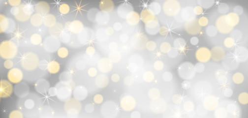 Silver bokeh background. Christmas glowing silver and golden lights with sparkles. Holiday decorative effect.