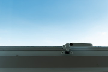 glass window in condominium with clear blue sky background