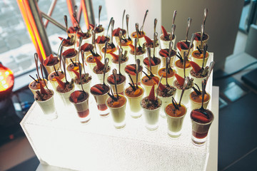 Desserts with fruit in vases. Advertising concept of desserts, sweets, cooking, holidays