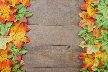 Autumn Maple leave border frame on wooden background