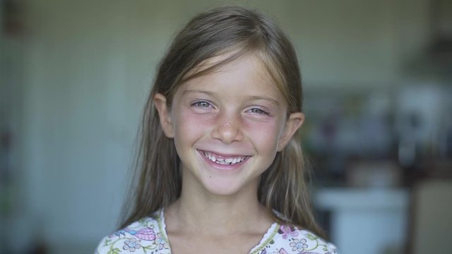 Portrait of Happy Smiling Laughing Little Child after Dental Treatment in Slow Motion.